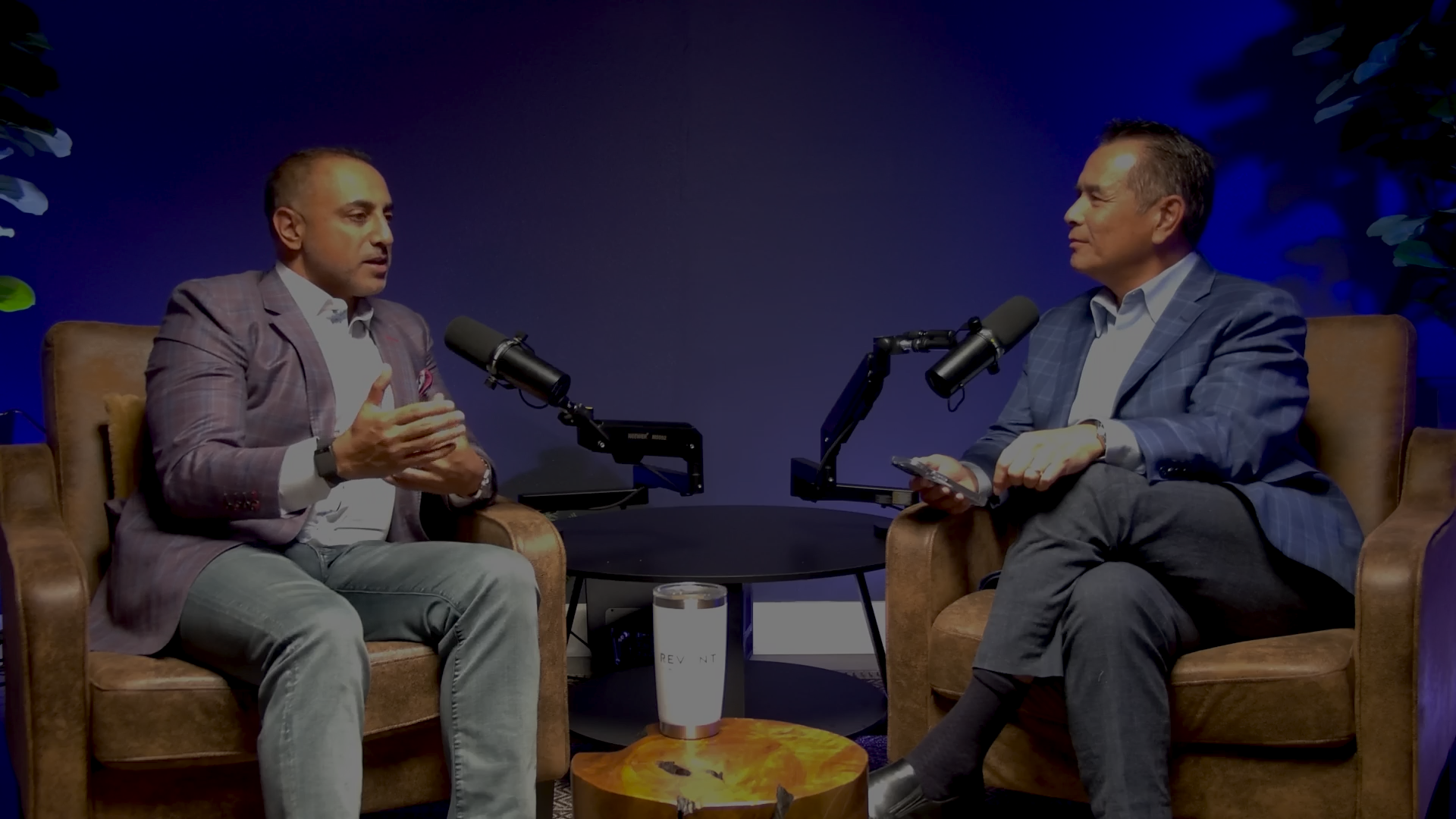 Two executives in conversation on the BHIVE Studio set